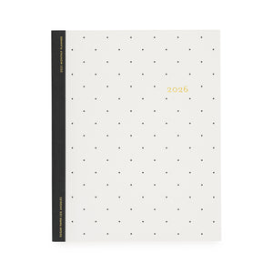 White planner with black dot pattern and '2026' gold foil on cover