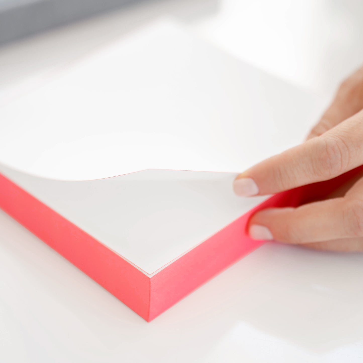 Side view of painted neon notepad