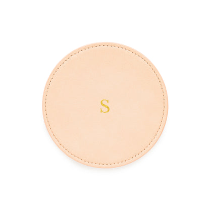 Pale pink vegan leather coasters with gold foil initial