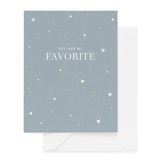 slate blue card with white text and gold accents, white envelope