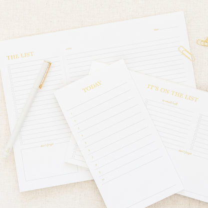 white and gold list pads