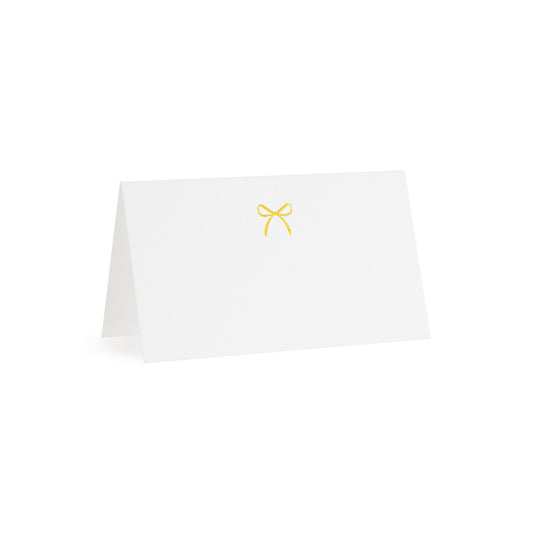 white tented place card with gold bow