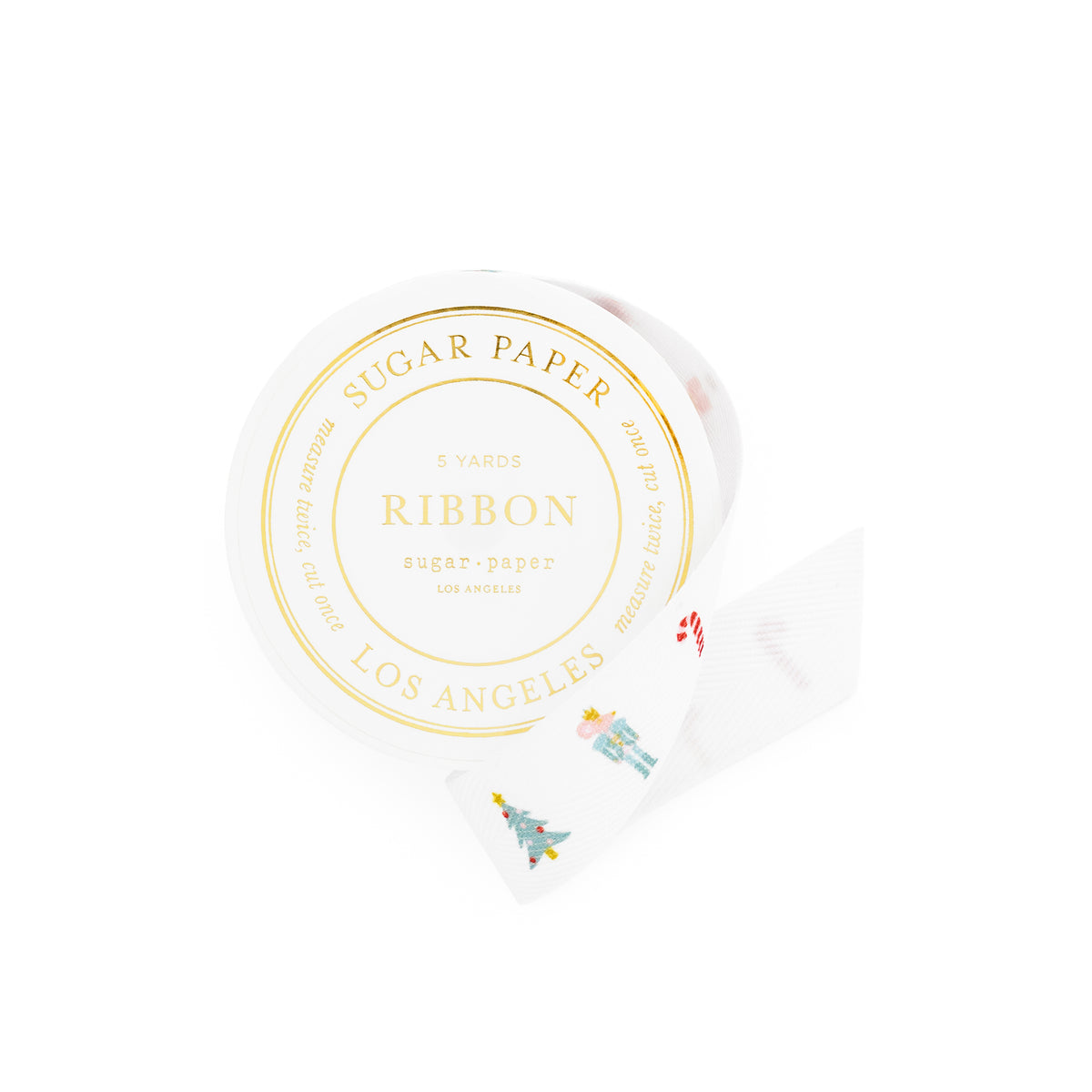 A roll of white sugar paper ribbon with colorful holiday icons printed on it, shown on a clean white background. The round label on the roll reads 'SUGAR PAPER RIBBON LOS ANGELES' in gold foil