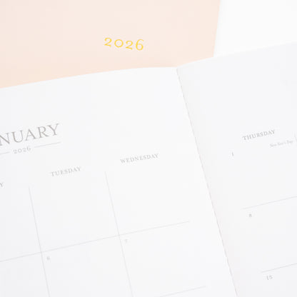 pink monthly 2026 planner with closeup of january 2026 monthly calendar