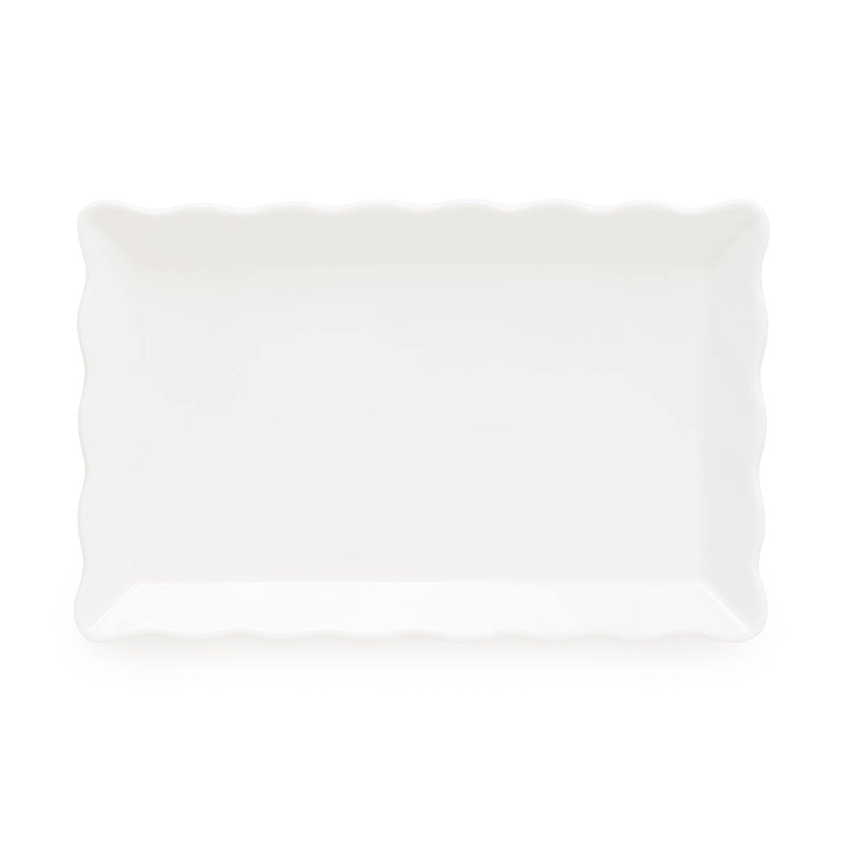 A rectangular white ceramic catch-all tray with a wavy scallop rim