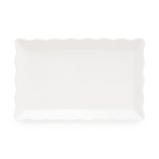 A rectangular white ceramic catch-all tray with a wavy scallop rim