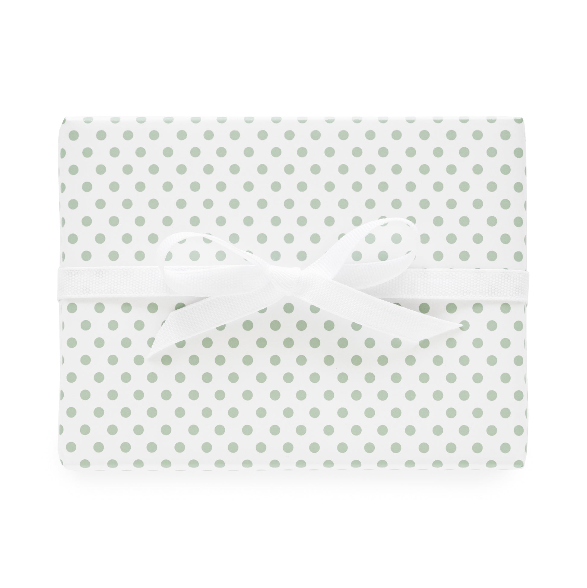 white and green dot wrapping paper wrapped gift with white bow