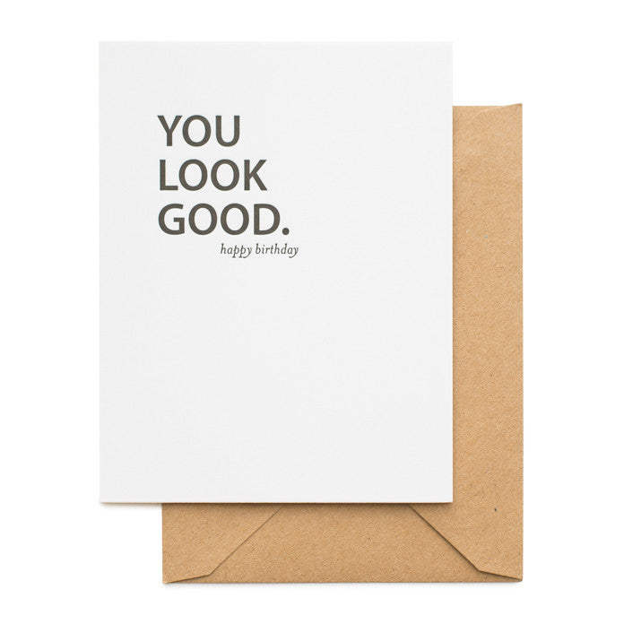 Black and white birthday card with kraft envelope
