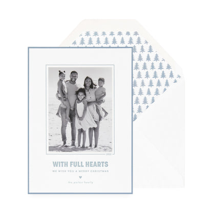white card with photo, slate blue text and border, white envelope with blue tree liner