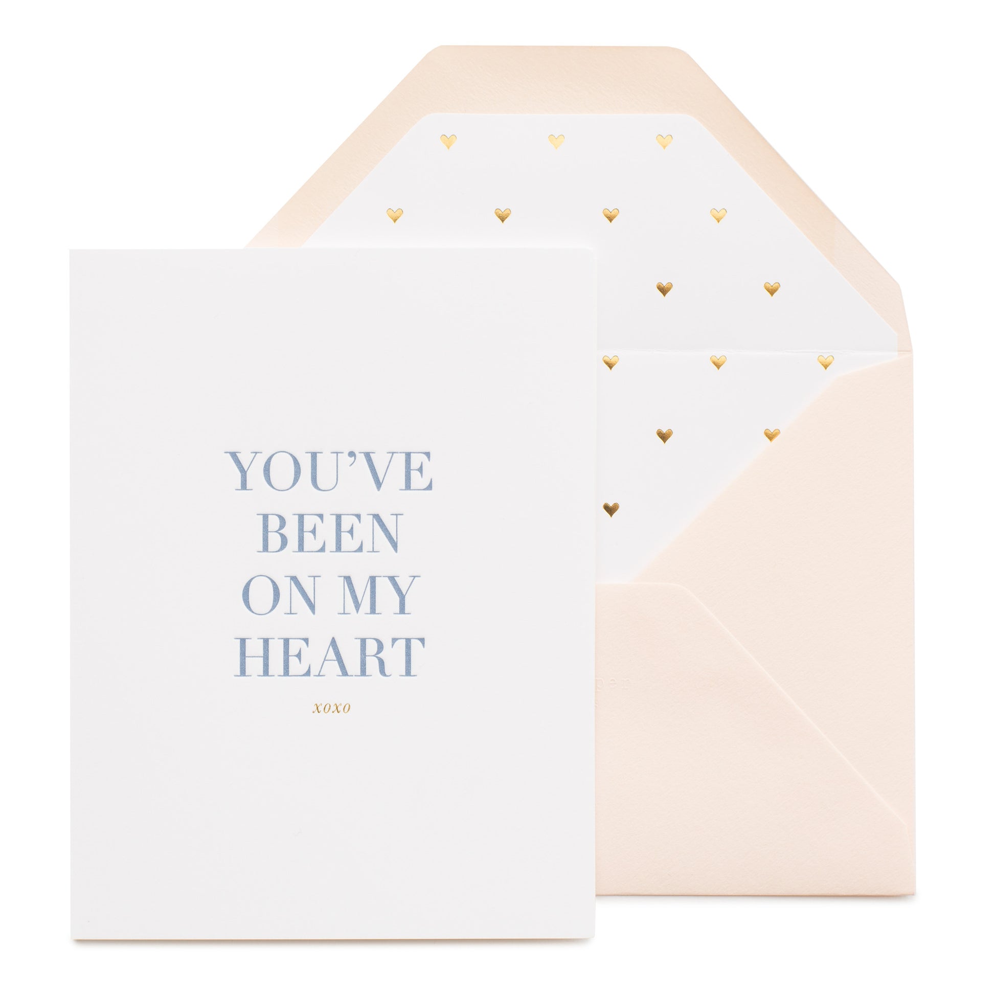 White card printed with blue ink you've been on my heart with a gold heart lined pink envelope