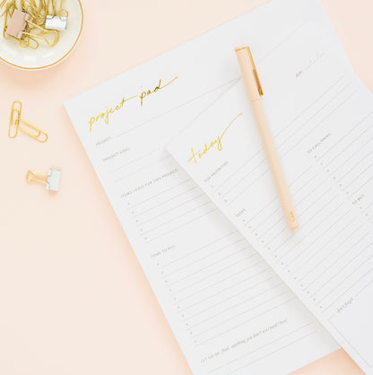 Stack of gold foil today and project pad notepads
