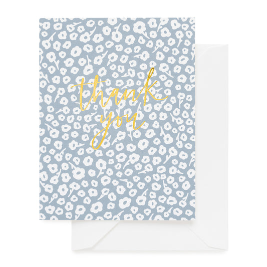 blue floral card with gold foil script and white envelope